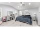 Serene bedroom with a ceiling fan, silver accents, and an upholstered headboard at 3535 E Crescent Way, Gilbert, AZ 85298