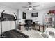 Home office with desk, treadmill, ceiling fan, and ample storage at 3535 E Crescent Way, Gilbert, AZ 85298