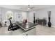 Well lit office with tile floors, ceiling fan, comfortable desk chair, modern desk, and stylish decorations at 3535 E Crescent Way, Gilbert, AZ 85298
