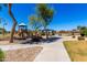 Community playground with play structure, picnic tables, and green spaces, perfect for Gathering fun and recreation at 3535 E Crescent Way, Gilbert, AZ 85298