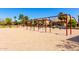 Community playground featuring swing sets, mature trees, and well-maintained landscaping in a desirable neighborhood at 3535 E Crescent Way, Gilbert, AZ 85298
