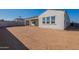 Expansive backyard space with a covered patio, ideal for outdoor gatherings and recreation at 35703 N Geode Way, San Tan Valley, AZ 85144