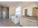 Luxurious bathroom featuring a soaking tub, dual vanities, and a walk-in shower at 35703 N Geode Way, San Tan Valley, AZ 85144