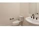 Elegant powder room featuring sleek fixtures, pedestal sink, and contemporary design at 35703 N Geode Way, San Tan Valley, AZ 85144