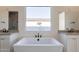 Elegant bathroom featuring a freestanding tub, dual vanities and modern fixtures at 35703 N Geode Way, San Tan Valley, AZ 85144