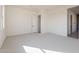 Spacious bedroom with neutral decor, plush carpeting, and convenient ensuite access at 35703 N Geode Way, San Tan Valley, AZ 85144