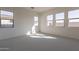 Inviting bedroom with plenty of natural light streaming through multiple windows at 35703 N Geode Way, San Tan Valley, AZ 85144