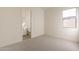 Bright bedroom with attached bathroom, window and neutral carpet at 35703 N Geode Way, San Tan Valley, AZ 85144