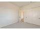 Comfortable bedroom with sliding door closet, neutral walls, and carpet, providing a peaceful retreat at 35703 N Geode Way, San Tan Valley, AZ 85144