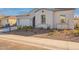 Landscaped front yard and charming details create a welcoming curb appeal at 35703 N Geode Way, San Tan Valley, AZ 85144