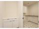 Bright laundry room featuring star pattern floors and storage at 35703 N Geode Way, San Tan Valley, AZ 85144