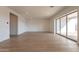 Bright living room featuring wood-look flooring, recessed lighting, and neutral paint at 35703 N Geode Way, San Tan Valley, AZ 85144