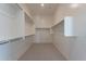 Spacious walk-in closet with white shelving and ample storage space for an organized wardrobe at 35703 N Geode Way, San Tan Valley, AZ 85144