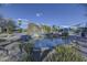 A community pool area showcasing desert landscaping, stone features, and a serene water feature at 37170 N Greythorn Cir, Carefree, AZ 85377