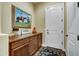 Mud room showcasing cabinet storage, decorated walls, and a white entry door at 37170 N Greythorn Cir, Carefree, AZ 85377