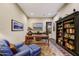 Traditional home office with built-in bookshelves, desk, area rug, and ample natural light at 37170 N Greythorn Cir, Carefree, AZ 85377