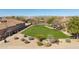 Beautifully maintained green space in the backyard with desert landscaping and lush greenery at 3822 E Tracker Trl, Phoenix, AZ 85050