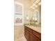 Bathroom with granite countertop, dark wood cabinetry, and decorative floral arrangement at 3822 E Tracker Trl, Phoenix, AZ 85050