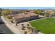 Lovely single-story home featuring a tiled roof, desert landscaping, and lush green grass at 3822 E Tracker Trl, Phoenix, AZ 85050