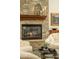 Close-up of the stone fireplace in the living room with decorative mantle and stone hearth at 3822 E Tracker Trl, Phoenix, AZ 85050