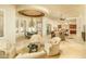 An elegant dining area that is open to the living room, with a decorative ceiling and natural light at 3822 E Tracker Trl, Phoenix, AZ 85050