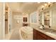 Luxurious main bathroom featuring a soaking tub, dual vanities, and elegant mosaic tile details at 3822 E Tracker Trl, Phoenix, AZ 85050