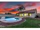 A private backyard featuring a sparkling swimming pool, covered patio, and low-maintenance landscaping at 3861 S Acacia Ct, Chandler, AZ 85248