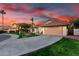 Charming single-Gathering home featuring a two-car garage and lush green lawn with desert landscaping at 3861 S Acacia Ct, Chandler, AZ 85248
