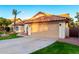 Charming single-story home featuring a well-manicured lawn, desert landscaping, and a two-car garage at 3861 S Acacia Ct, Chandler, AZ 85248