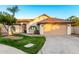 Charming single-story home featuring a well-manicured lawn, desert landscaping, and a two-car garage at 3861 S Acacia Ct, Chandler, AZ 85248