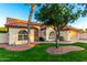 Charming single-story home featuring a well-manicured lawn, desert landscaping, and a two-car garage at 3861 S Acacia Ct, Chandler, AZ 85248