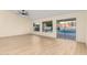 Spacious living room with slider door and views of the private backyard swimming pool at 3861 S Acacia Ct, Chandler, AZ 85248