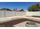 Well-maintained backyard with gravel beds and an outdoor firepit, perfect for relaxation at 39894 N Fazio Ln, San Tan Valley, AZ 85140