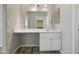 A bathroom features an extended vanity and a view into a walk-in closet at 39894 N Fazio Ln, San Tan Valley, AZ 85140