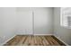 A bedroom features a closet with sliding doors, a window, and laminate flooring at 39894 N Fazio Ln, San Tan Valley, AZ 85140