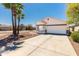 Charming single-story home with a well-manicured front yard and a two-car garage at 39894 N Fazio Ln, San Tan Valley, AZ 85140