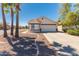 Charming single-story home with a well-manicured front yard and a two-car garage at 39894 N Fazio Ln, San Tan Valley, AZ 85140