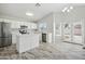 Modern kitchen with stainless steel appliances, white cabinets, and a central island at 39894 N Fazio Ln, San Tan Valley, AZ 85140