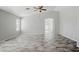 Bright living room with high ceilings, a ceiling fan and wood-look tile floors for a modern look at 39894 N Fazio Ln, San Tan Valley, AZ 85140
