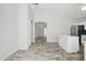 Open-concept kitchen and living room featuring modern flooring and ample natural light at 39894 N Fazio Ln, San Tan Valley, AZ 85140