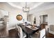 Dining room showcases hardwood floors, stylish lighting, and seamlessly connects to other living spaces at 4027 E Goldfinch Gate Ln, Phoenix, AZ 85044