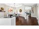 Formal dining room with elegant lighting, hardwood floors, and seamless flow to other living spaces at 4027 E Goldfinch Gate Ln, Phoenix, AZ 85044