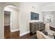 Living room featuring an arched entryway, console, and views to other rooms at 4027 E Goldfinch Gate Ln, Phoenix, AZ 85044