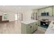 Kitchen featuring shaker cabinets, stainless steel appliances, and a marble-top island at 4027 W Golden Ln, Phoenix, AZ 85051