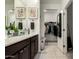 Modern bathroom features a double sink vanity and a walk-in closet at 40467 W Jenna Ln, Maricopa, AZ 85138