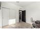 Bright bedroom with a closet and an entry to the bathroom at 40467 W Jenna Ln, Maricopa, AZ 85138