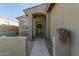 Inviting front entrance featuring a decorative wreath on the front door and a manicured walkway at 40467 W Jenna Ln, Maricopa, AZ 85138