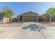 Charming single-story home with a two-car garage, desert landscaping, and neutral exterior paint at 40467 W Jenna Ln, Maricopa, AZ 85138