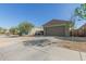A single story home with a two car garage, desert landscaping, and neutral exterior paint at 40467 W Jenna Ln, Maricopa, AZ 85138