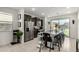 Modern kitchen with dark cabinets, stainless steel appliances, and granite countertops at 40467 W Jenna Ln, Maricopa, AZ 85138